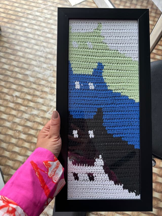Pixel grid crochet cats art